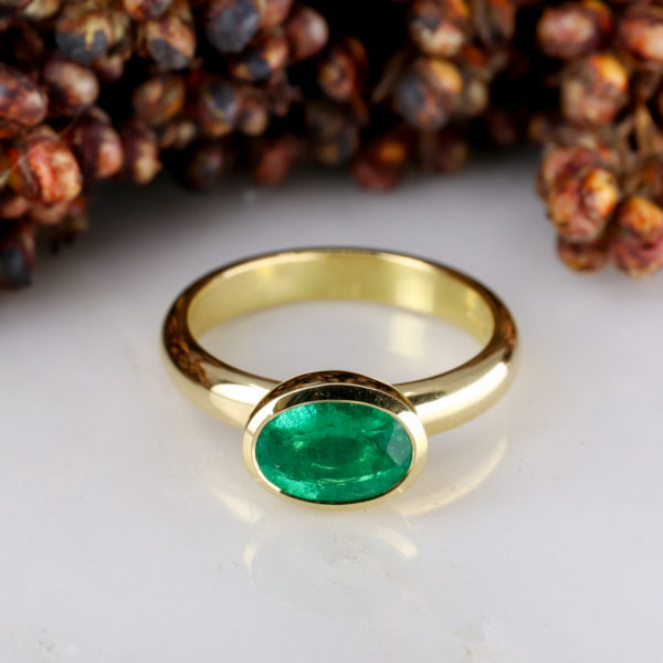 18Y - East west rubover set 1.19ct emerald on 3mm wide band-1