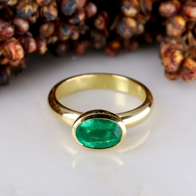 18Y - East west rubover set 1.19ct emerald on 3mm wide band-1