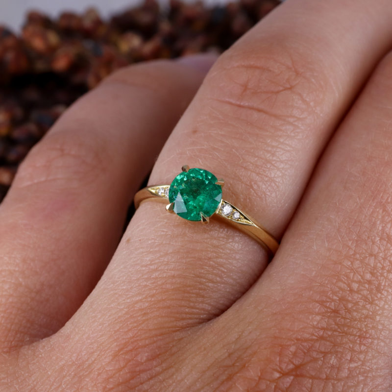 18ct yellow gold mini coco engagement ring with a 0.90ct round emerald