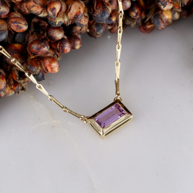 9ct yellow gold and pink sapphire baguette pendant
