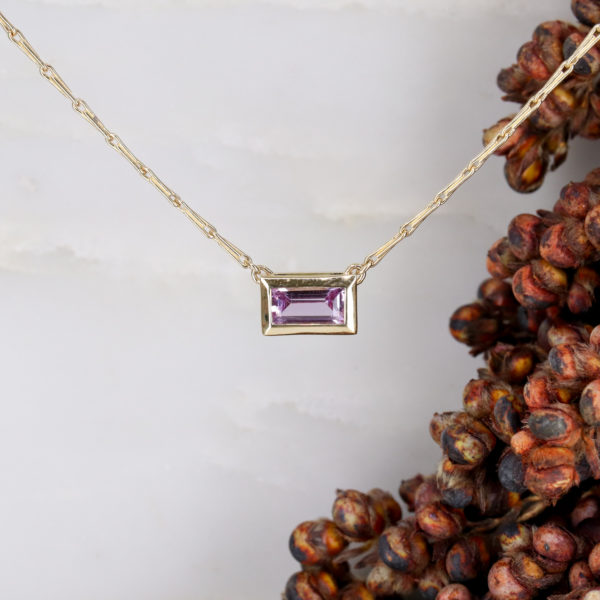 9ct yellow gold and pink sapphire baguette pendant