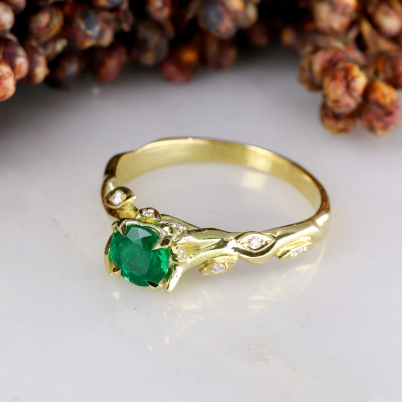 Rose and thorn - 18Y solitiare with 0.50ct round emerald centre and white diamond leaves