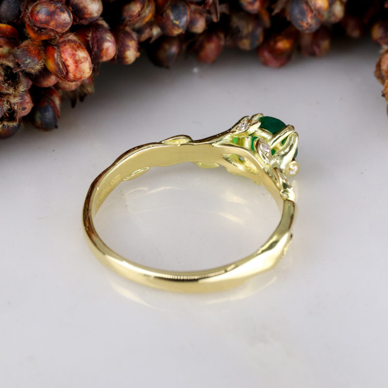 Rose and thorn - 18Y solitiare with 0.50ct round emerald centre and white diamond leaves