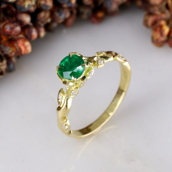Rose and thorn - 18Y solitiare with 0.50ct round emerald centre and white diamond leaves