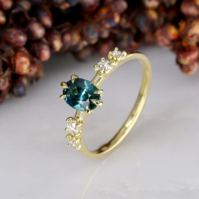 18Y - Oval teal sapphire with 2 claw set white diamonds each side - EXPORT-4 18Y - Oval teal sapphire with 2 claw set white diamonds each side - EXPORT-4