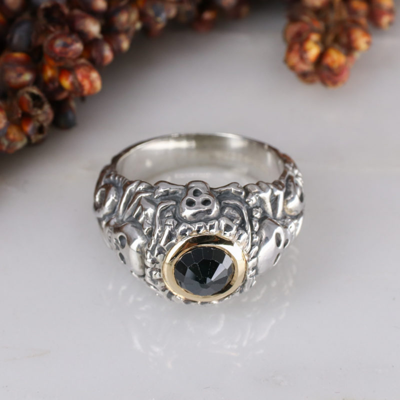 Silver pirate ring with 9ct yellow gold rubover set sapphire