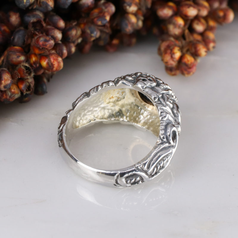 Silver pirate ring with 9ct yellow gold rubover set sapphire