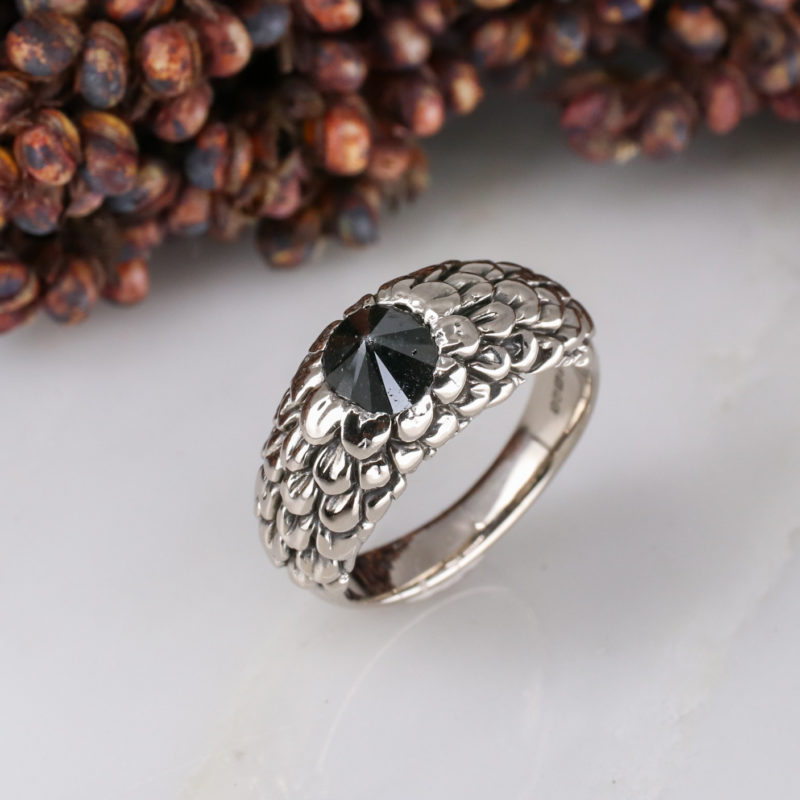 18ct white gold feathered ring with up-side-down set black diamond