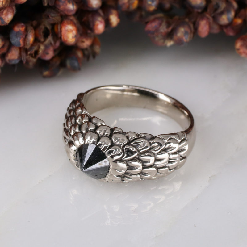 18ct white gold feathered ring with up-side-down set black diamond