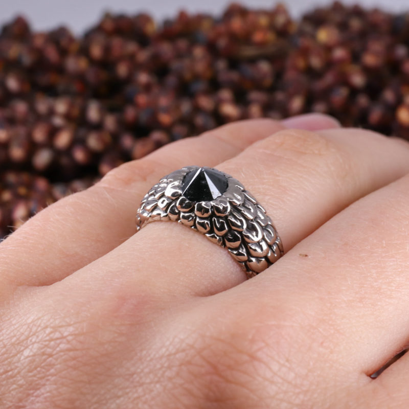 18ct white gold feathered ring with up-side-down set black diamond