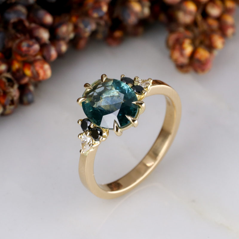 18ct yellow gold cluster with double cut teal sapphire