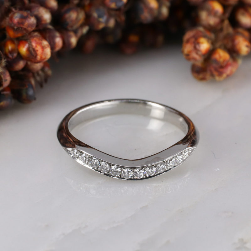 Platinum coco curve wedding band with white diamonds