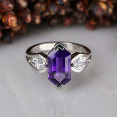 Elongated amethyst hexagon centre and marquise diamond sides