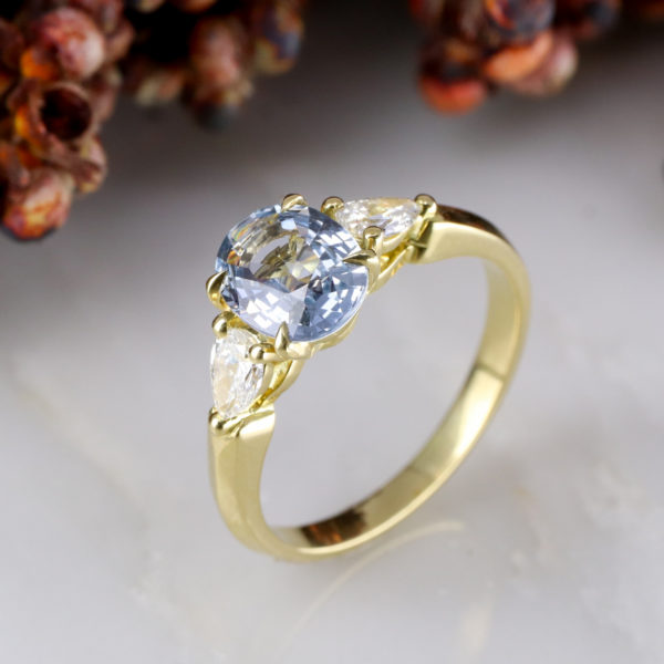18ct yellow gold cornflower blue sapphire and diamond trilogy ring